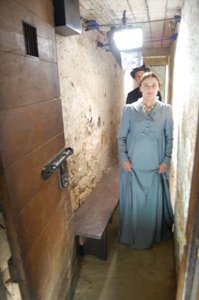 Anne Solomon in the tunel being led up into Court